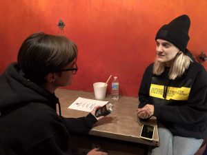 Liza Anne is interviewed by Monty Daniel in the coat check room at the Gothic Theatre on November 1st, 2019. Photo by Kyle Colley.