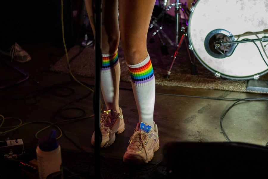 AJ Frankson shows her support for LGBTQ+ by wearing rainbow socks to shows with her band, Janet Earth. Nov. 16, 2019. (Monty Daniel | Collegian)
