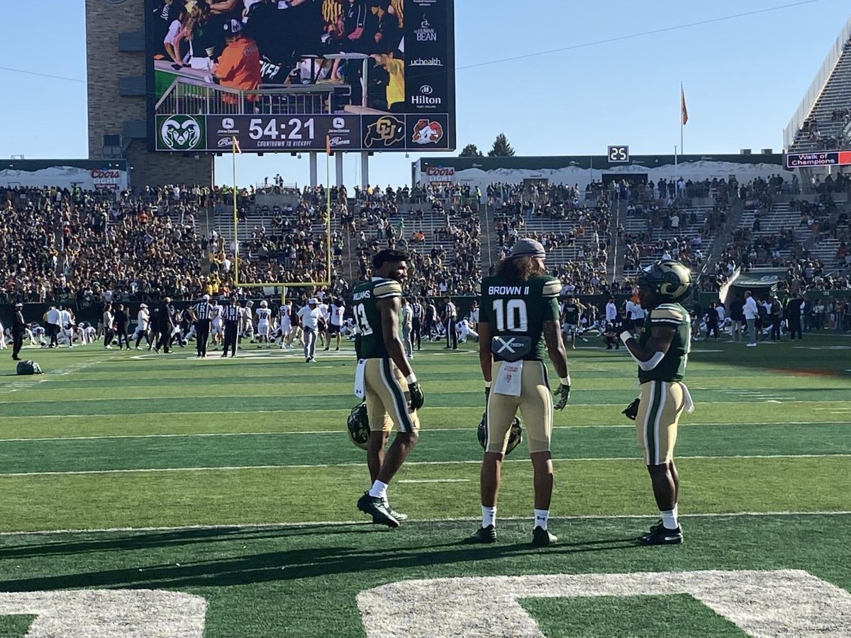 From left to right; (13) Jordan Williams, (10) Vince Brown II, and (0) Kobe Johnson in the endzone conversating during warmups before the game.