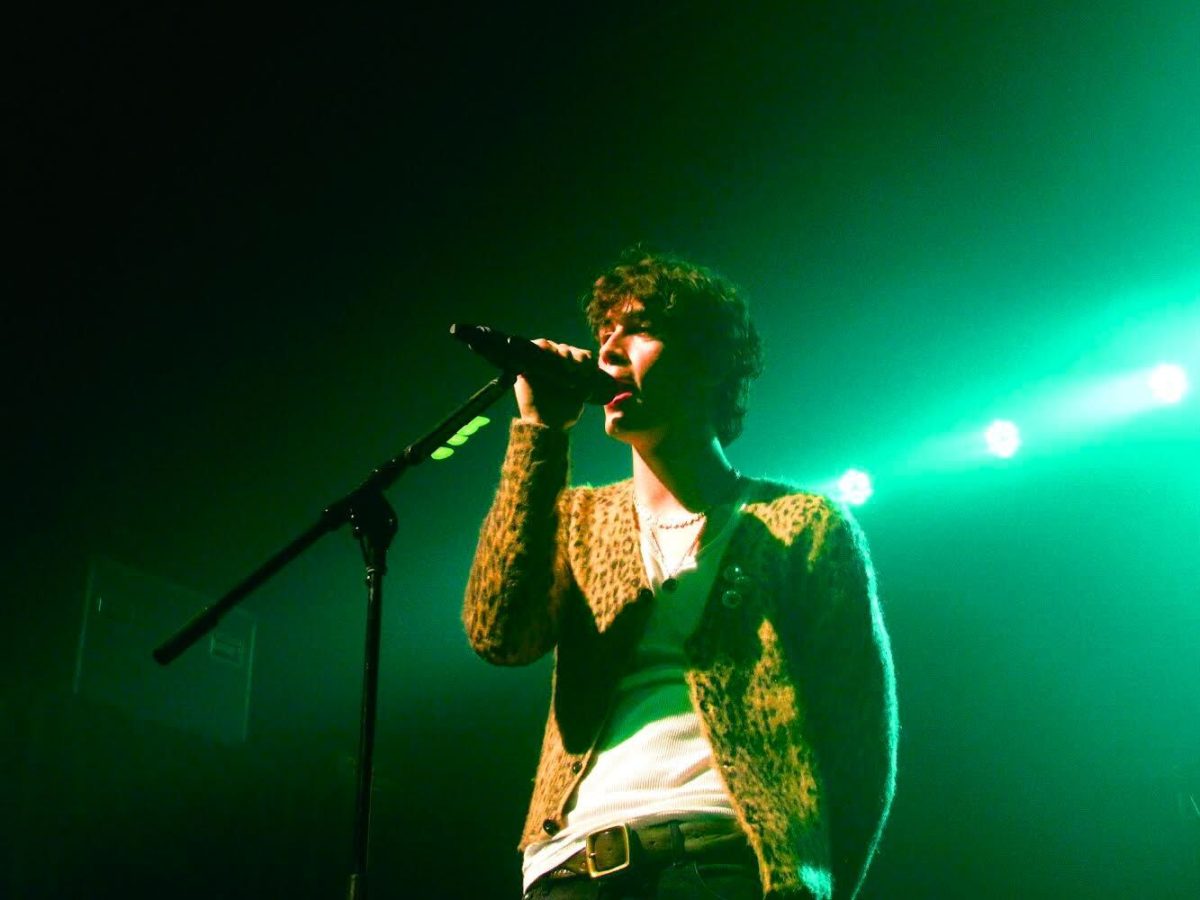 Aiden Bissett singing at the Aggie Theatre. Photo by Lauren Patrick