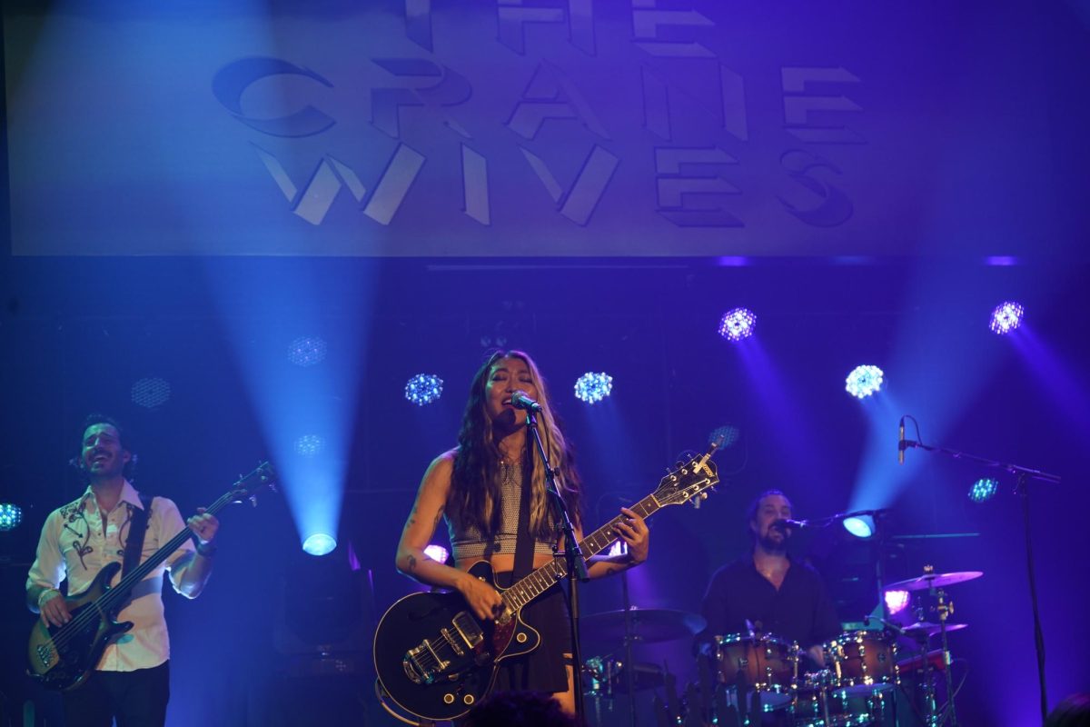 Members of the Crane Wives, Emilee Petersmark, Ben Zito, and Dan Rickabus, preforming at Washington's August 7.